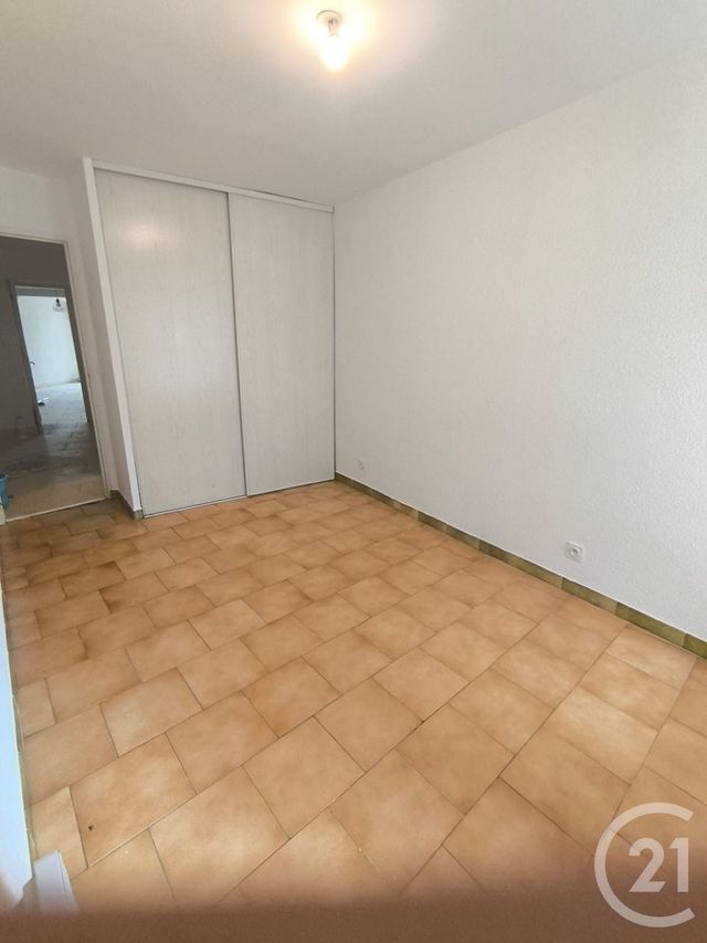 Appartement F3 à louer - 3 pièces - 77.07 m2 - LEZAN - 30 - LANGUEDOC-ROUSSILLON - Century 21 Impact Immobilier